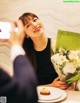 A woman taking a picture of herself with a cell phone.